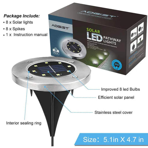 Solar Ground Lights 8 Pack Waterproof White LED Disk with stainless steel cover and efficient solar panel next to package box