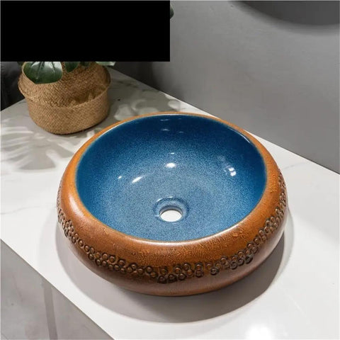 USZWBY Vessel Vanity Sink Retro Small Bathroom Sink Simple Round Above Counter Basin with Faucet and Drain Modern Countertop blue and brown ceramic sink on a countertop.