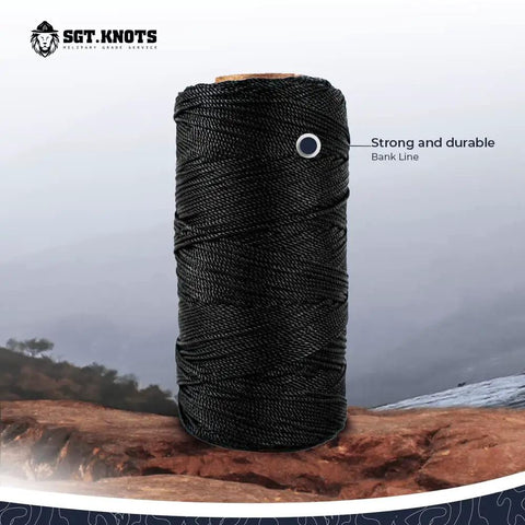 Tarred Nylon Bank Line Twine For Bushcraft And Outdoor Projects, weatherproof black lacing cord spool on rocky terrain