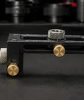 Dead On Positioning Guide With Swappable Stainless Bushings And Knurled Lock Knobs heavy duty alignment jig close-up of locking knobs and metallic components.