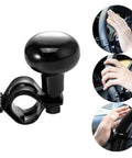 One Hand Drive Steering Wheel Knob Power Handle For Cars Trucks Marine Boats Universal Ball Grip With Palm Pad Beefy Stainless Steel And ABS Rust Proof Build Provides Smooth 360 Degree One Hand Control, shown in various usage positions.