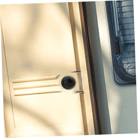 Flush pull slam latch, black, installed on boat cabin door.
