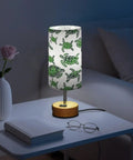 Green Watercolor Turtle Decor Bedside Table Lamp With 3 Way Dimming Touch Built In Charging Station For Nightstand Or Desk USB C Port USB Port 2 Pin Outlet LED Bulb Included on a nightstand with book and glasses