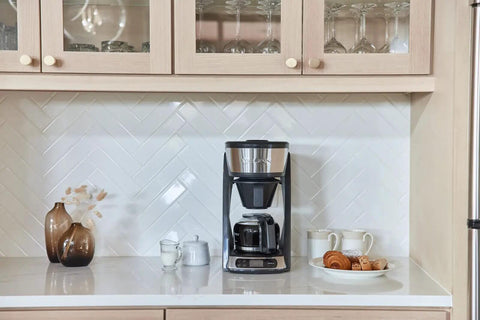 Heat N Brew 10 Cup Programmable Coffee Maker with Stainless Steel Finish on kitchen counter, ideal for home cafe.
