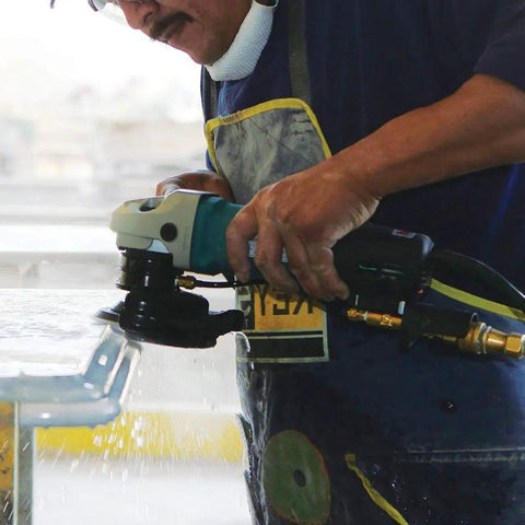 Worker using 4 Inch Electronic Stone Polisher with Variable Speed Control, Soft Start, and Constant Speed Under Load on stone surface