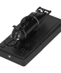 RC Submarine Remote Control Toy for Kids 2.4G Six Channel Model with water-activated safety system, resting on controller.