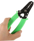 Portable Wire Stripper Pliers With Soft Grips Rapidly Strips Copper Jacketing held in hand with green grips.