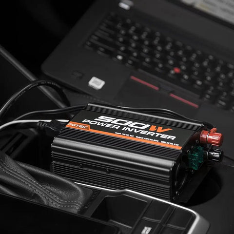 Ride Ready 500W Car Power Inverter Converts 12V DC To 110V AC With Dual USB Ports, compact design with connections in vehicle.
