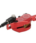 Rock Solid Four Piston Hydraulic Disc Brake Set For Mountain Bikers With Drop Dead Smooth Bilateral Oil Lines And Tough Resin Pads For Hardtail Or Full Suspension Shredding, close-up view of red brake caliper with hydraulic line.
