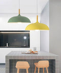 Modern Nordic Style Hanging Lamp Fixture Featuring Solid Wood Accents And Durable Iron Base Super Sleek Green Metal Shade For Kitchen Island Dining Table Bedroom Cozy Hangout Vibe in kitchen setting.