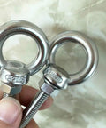 Two Shoulder Eye Bolts M8 Stainless Steel Built Tough Heavy Duty With Washers And Nuts, showcasing long shank thread.