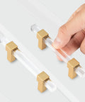 10 Pack 5 Inch Gold Acrylic Drawer Pulls with Seven Point Five Inch Overall Length for Kitchen Cabinets, hand holding clear handle