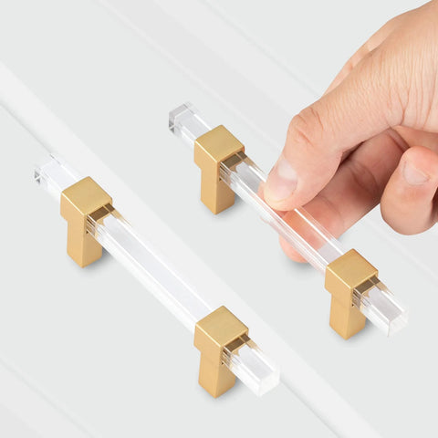 10 Pack 5 Inch Gold Acrylic Drawer Pulls with Seven Point Five Inch Overall Length for Kitchen Cabinets, hand holding clear handle