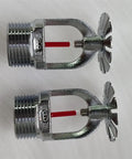 Rock-Solid Pendent Fire Sprinkler Head With Quick Response 155 Degrees Activation And Chrome Finish, two chrome sprinkler heads with red glass bulbs.