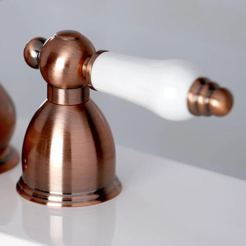 Close-up of Restoration Mini Widespread Lavatory Faucet handle with porcelain lever, polished chrome finish, solid brass.