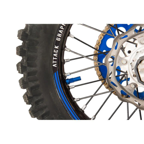 Tusk rim lock nut/spacer kit blue mounted on dirt bike front wheel with disc brake rotor