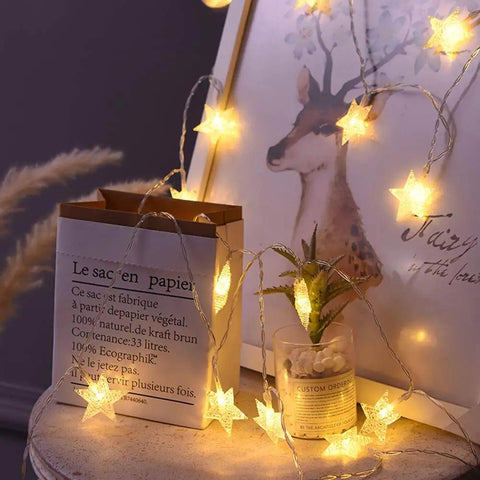 Warm White LED Star String Lights 10 Ft Battery Operated For Indoor Outdoor Decor, stars draped on deer picture frame