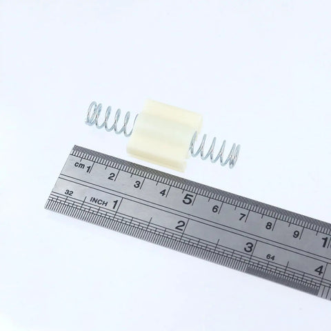 8-Pcs Bifold Door Top Roller Guides And Repair Springs Kit For Closet Doors Fits 1 In To 1-3/8 In Thick Panels Durable Plastic And Stainless Steel Hardware Easy DIY Track Fix For Smooth Sliding, plastic guide and springs shown with ruler