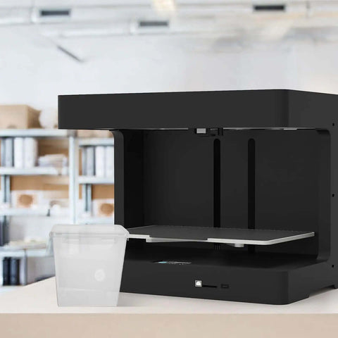 Filament Storage Box For 3D Printer With Drying System And Airtight Waterproof Seal 5.8L Capacity next to a 3D printer in a workspace