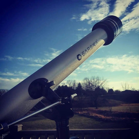 Starwatcher 50mm Refractor Telescope For Beginners With 600mm Focal Length And Coated Optics set up outdoors.