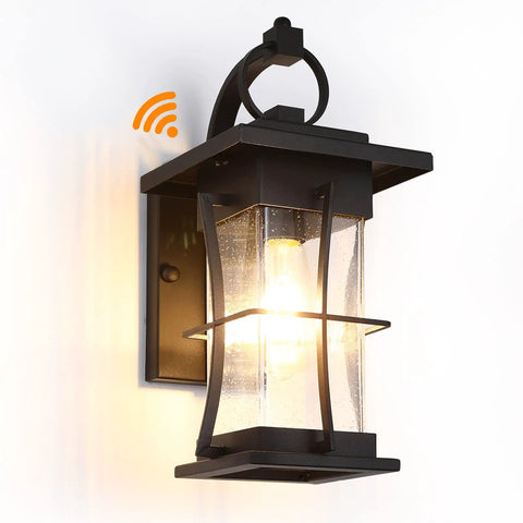 Dusk To Dawn Outdoor Wall Lantern With Sensor, Matte Black Porch Light, glowing against a white background