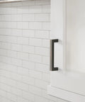 Monument Oil Rubbed Bronze Cabinet Pull 3-3/4 Inch Center-to-Center 4-1/8 Inch Overall Length on white kitchen cabinet