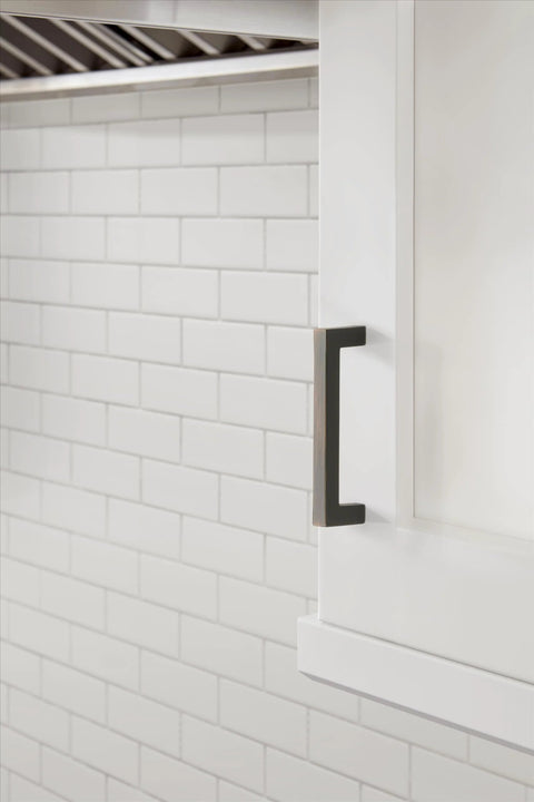 Monument Oil Rubbed Bronze Cabinet Pull 3-3/4 Inch Center-to-Center 4-1/8 Inch Overall Length on white kitchen cabinet