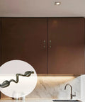 Leaf Shape Drawer Pull Handle Set In Vintage Bronze Finish installed on kitchen cabinets, with a close-up inset showing twig branch design.