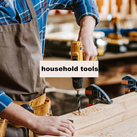 Person drilling into wood with a hand drill in a workshop, surrounded by various tools, clamps, and household tools sign.