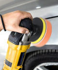 Hand using 10 Pack Car Polishing Pads 3 Inch Foam Buffing Pads For Drill With M10 Adapter on car exterior