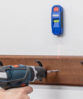 Magnetic Stud Finder With Laser Mark Tech For Precise Wall Scans And Framing, Hands Free Magnetic Locator And Wall Scanner, Pro Grade Stud Magnet Tool For Quick Accurate Marking And Safer Installations mounted on white wall with drill below