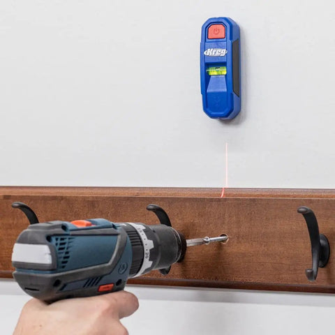 Magnetic Stud Finder With Laser Mark Tech For Precise Wall Scans And Framing, Hands Free Magnetic Locator And Wall Scanner, Pro Grade Stud Magnet Tool For Quick Accurate Marking And Safer Installations mounted on white wall with drill below