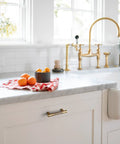 Kitchen with Six Pack Knurled Cabinet Pulls Antique Brass Drawer Handles 5.04 Inch Center to Center installed on white cabinets