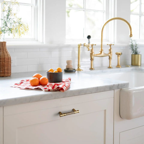 Kitchen with Six Pack Knurled Cabinet Pulls Antique Brass Drawer Handles 5.04 Inch Center to Center installed on white cabinets