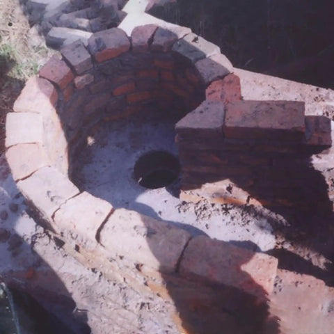 Circular brick structure for a hydro installation site with central outlet opening, potential setup for 5000W Three Phase Axial Flow Hydro Generator Set 400V