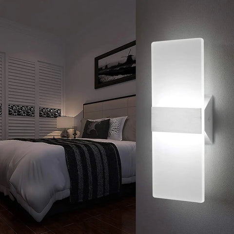 Modern LED Wall Sconce 12W Cool White 6000K up down light in a bedroom setting with bed and lamp, aluminum and acrylic design.