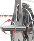 Close-up of heavy duty stainless steel garden hose reel with flexible rocker mechanism for easy operation.