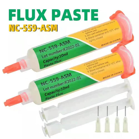 Two syringes of NC-559-ASM flux paste with orange caps and green labels, shown with applicator tips.