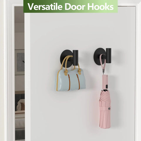 Self-Adhesive Rust-Resistant Stainless Steel Coat Hooks Heavy-Duty No-Drill Wall Hangers for Towels Robes Coats Hats Black 2 Pack Ideal for Bathrooms Kitchens and Hotels with bag and umbrella.