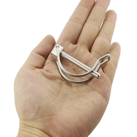 Person holding a Pair Of Marine Grade Stainless Steel 316 Quick Lock Release Trailer Towing Coupler Safety Pin 4.5mm Diameter 50mm Length