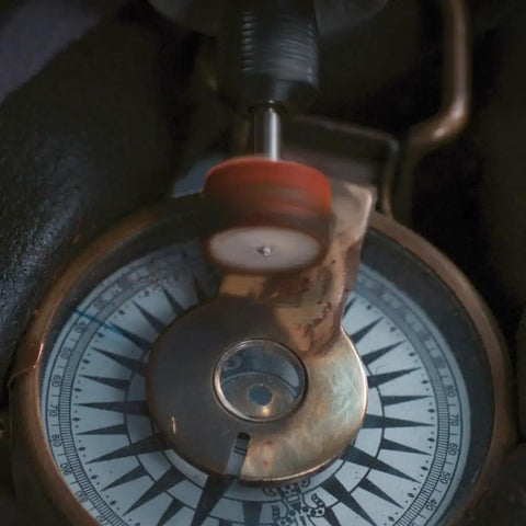 Polishing a metal compass with 20 Piece Cleaning And Polishing Micro Kit For Rotary Tools With Reusable Case