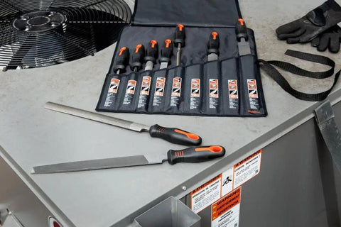 Ergonomic 9 Piece File Set With 6 Inch 8 Inch 10 Inch And 12 Inch Bastard And Tapered Files Multicolor Handles on a workbench.