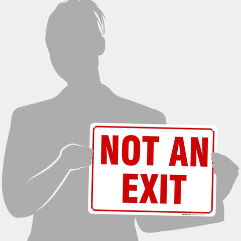 Built Tough Premium Aluminum Sign For Indoor And Outdoor Use No Fuss Rust Free Weatherproof And Ultra Durable With A Sharp Professional Look For Home Office Garage Shop And Retail Spaces. "NOT AN EXIT" sign held by person