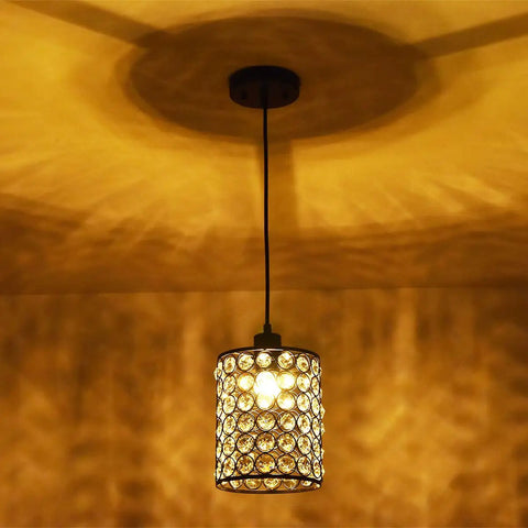 2 Pack Chrome Crystal Pendant Lights With Long Adjustable Cords, Modern Silver Ceiling Fixtures casting warm light on ceiling