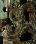Pebeo Gilding Wax close-up of decorative metal scrollwork with green patina and gold highlights