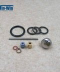 Front view of Win-Win waterjet maintenance kit components: O-rings, seals, metal rod, brass fittings, blue spacer.