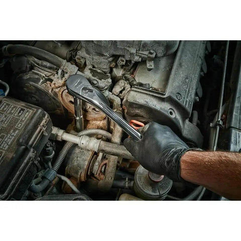 Hand using the Total Badass 1/2 Inch Drive Ratchet Socket Set 47 Piece on car engine parts for repairs.