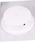 Bottom view of MiniKEYA Electric Rotating Display Stand USB Powered Turntable featuring a sturdy base and sleek white design.
