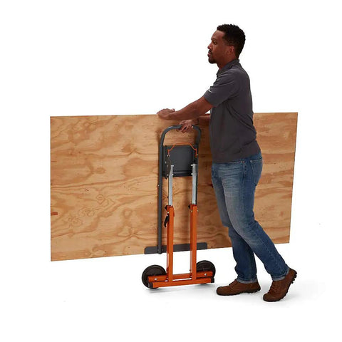 Man using Next Gen Panel Carrier and Panel Dolly, Table Saw Feed Stand with Adjustable Height, moving 4x8 sheet with ease.