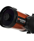Close-up of NexStar 5SE Schmidt-Cassegrain Telescope Bundle With Eyepiece Kit, orange tube and black mount visible.